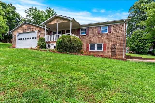 103 E St, Jonesville, NC 28642 - single story home with a front yard, a porch, an attached garage, and brick siding