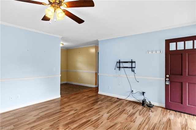 103 E St, Jonesville, NC 28642 - foyer entrance with crown molding, wood finished floors, and ceiling fan
