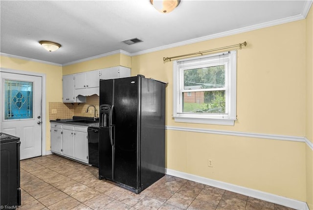 103 E St, Jonesville, NC 28642 - kitchen featuring black appliances, dark countertops, backsplash, ornamental molding, and light tile patterned floors