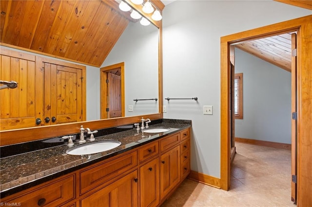7239 Bulb Rd, Julian, NC 27283 - full bathroom featuring lofted ceiling, double vanity, wood ceiling, and tile patterned flooring