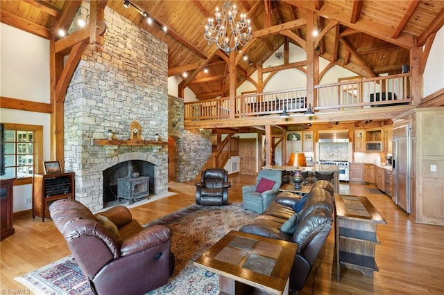 7239 Bulb Rd, Julian, NC 27283 - living room with high vaulted ceiling, a wood ceiling with exposed beams, a chandelier, light wood-style flooring, and track lighting