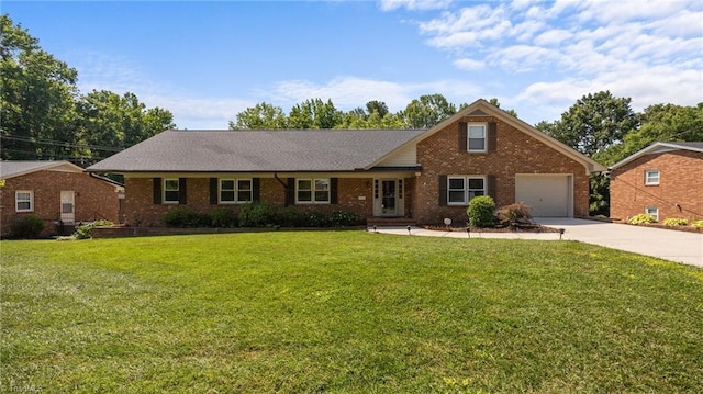 1926 Downing Dr, Burlington, NC 27215 - view of front of house with concrete driveway, brick siding, a front yard, and a garage