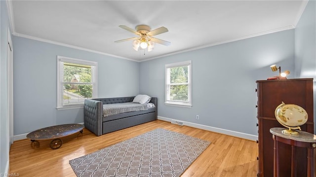 1926 Downing Dr, Burlington, NC 27215 - living area with crown molding, ceiling fan, and wood finished floors