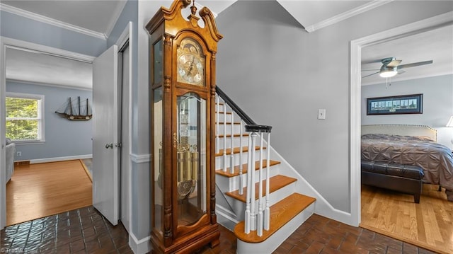 1926 Downing Dr, Burlington, NC 27215 - staircase featuring crown molding, brick floors, and a ceiling fan