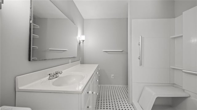 1926 Downing Dr, Burlington, NC 27215 - bathroom with vanity and tile patterned floors