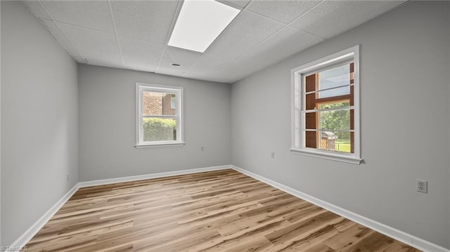 1926 Downing Dr, Burlington, NC 27215 - spare room featuring a drop ceiling and wood finished floors