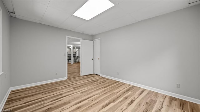 1926 Downing Dr, Burlington, NC 27215 - unfurnished room with light wood-style flooring and a drop ceiling