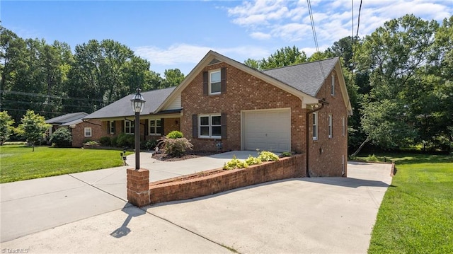 1926 Downing Dr, Burlington, NC 27215 - view of front of property with concrete driveway, brick siding, a front lawn, and a garage