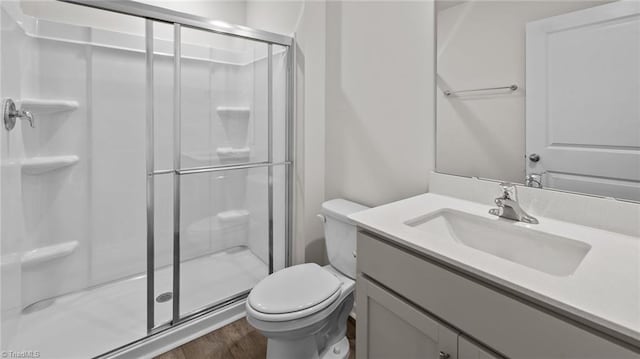 6598 Capstone Ct, Rural Hall, NC 27045 - full bathroom with toilet, a stall shower, wood finished floors, and vanity