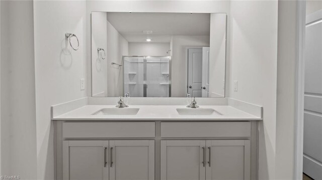 6598 Capstone Ct, Rural Hall, NC 27045 - bathroom featuring a stall shower and double vanity