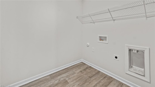 6598 Capstone Ct, Rural Hall, NC 27045 - laundry area with electric dryer hookup, washer hookup, wood finished floors, baseboards, and hookup for a gas dryer