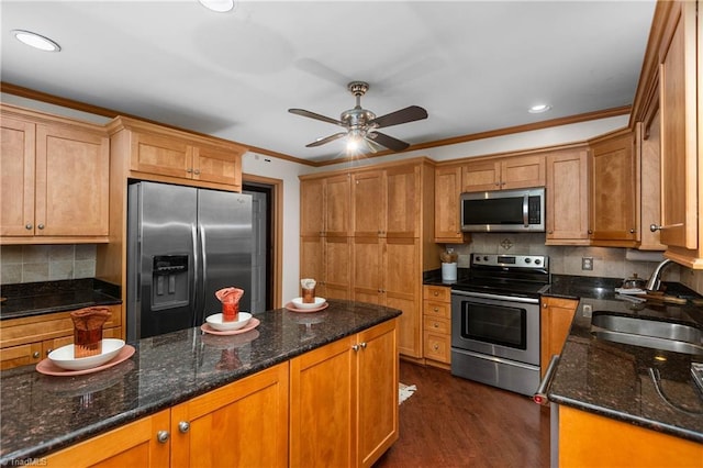 3228 Valley Rd, Winston-Salem, NC 27106 - kitchen with appliances with stainless steel finishes, crown molding, ceiling fan, dark stone counters, and tasteful backsplash