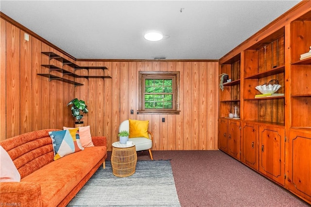 3228 Valley Rd, Winston-Salem, NC 27106 - sitting room featuring carpet floors, wooden walls, and crown molding