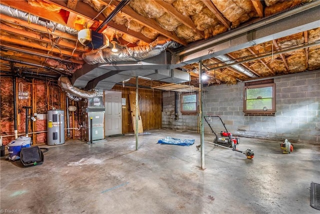 3228 Valley Rd, Winston-Salem, NC 27106 - below grade area with electric water heater, heating unit, and concrete block wall