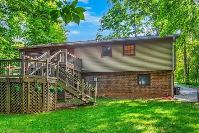 3228 Valley Rd, Winston-Salem, NC 27106 - back of house with stairway, a yard, a wooden deck, and brick siding