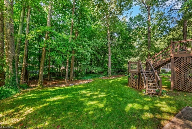 3228 Valley Rd, Winston-Salem, NC 27106 - view of green lawn with stairway and a wooden deck