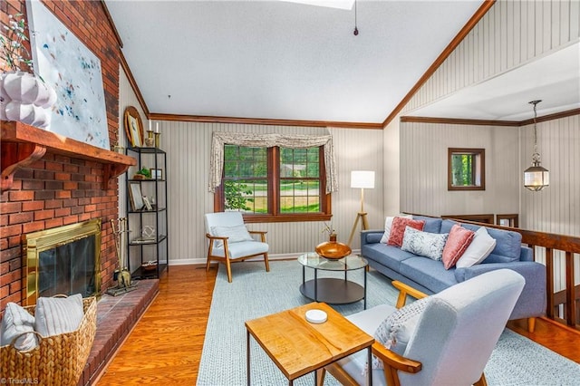 3228 Valley Rd, Winston-Salem, NC 27106 - living room featuring ornamental molding, a brick fireplace, wood finished floors, and a skylight