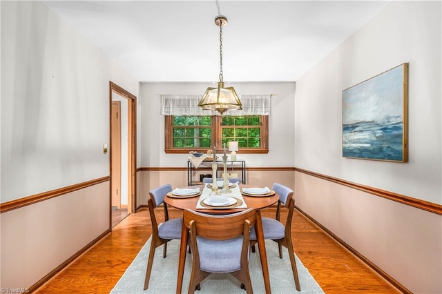 3228 Valley Rd, Winston-Salem, NC 27106 - dining room with wood finished floors and a chandelier