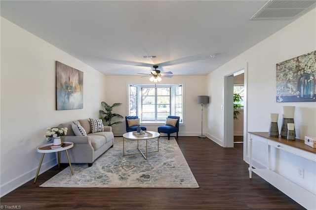 living room with ceiling fan and dark hardwood / wood-style floors