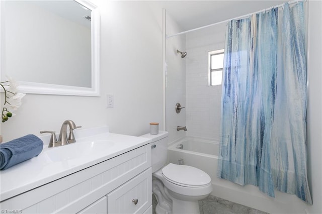 full bathroom featuring shower / bath combo with shower curtain, vanity, and toilet