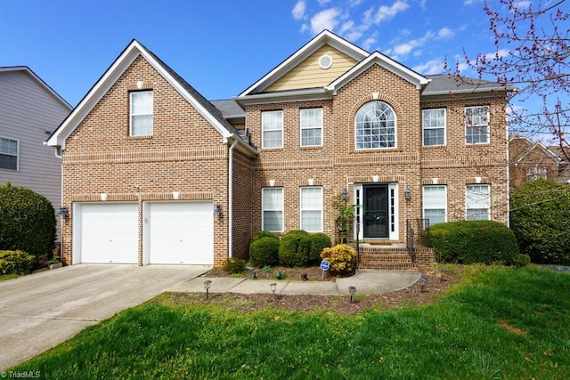 3704 Worthing Ct, Greensboro, NC 27455 - view of front of property with driveway, brick siding, and an attached garage