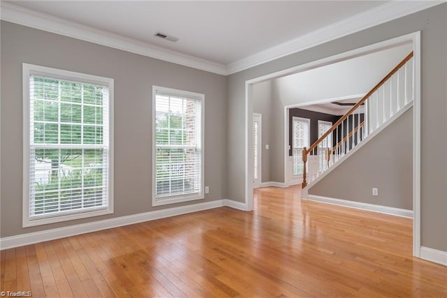 3704 Worthing Ct, Greensboro, NC 27455 - entryway featuring light wood-style flooring, baseboards, stairs, and ornamental molding