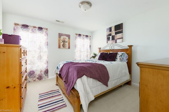 3704 Worthing Ct, Greensboro, NC 27455 - carpeted bedroom with baseboards