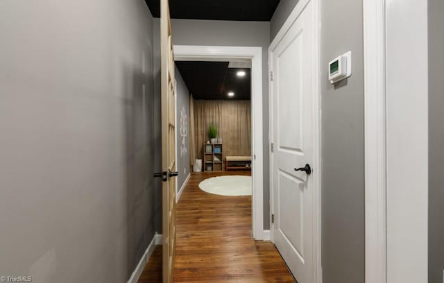 3704 Worthing Ct, Greensboro, NC 27455 - hallway featuring dark wood-type flooring and baseboards