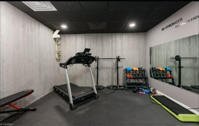 3704 Worthing Ct, Greensboro, NC 27455 - workout area with a drop ceiling, recessed lighting, and wooden walls