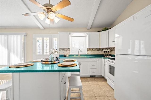 kitchen with white cabinetry, light tile patterned floors, white appliances, and a kitchen bar