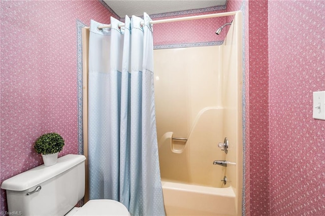 bathroom featuring toilet and shower / bath combo