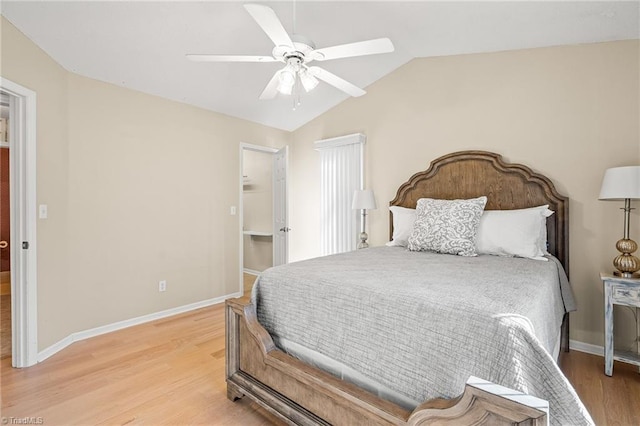 bedroom featuring ceiling fan, vaulted ceiling, and light wood-type flooring