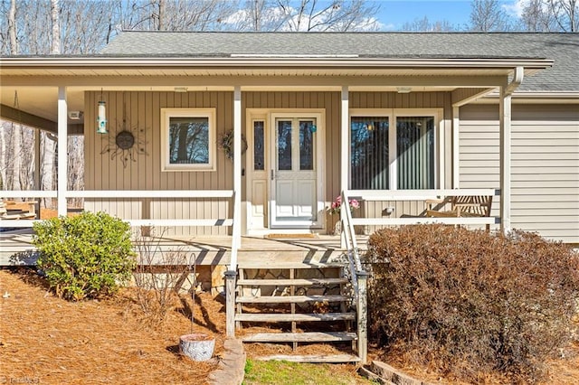 view of exterior entry featuring a porch