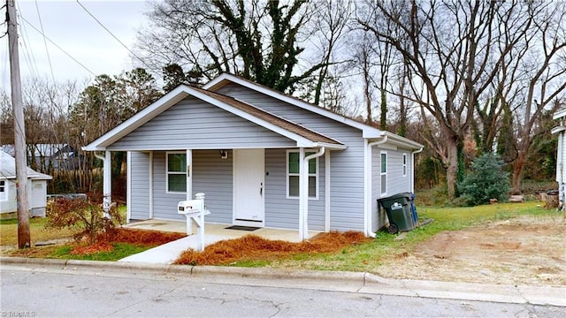 bungalow-style home featuring covered porch