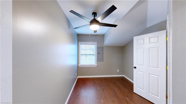 bonus room featuring dark hardwood / wood-style floors, ceiling fan, lofted ceiling, and electric panel