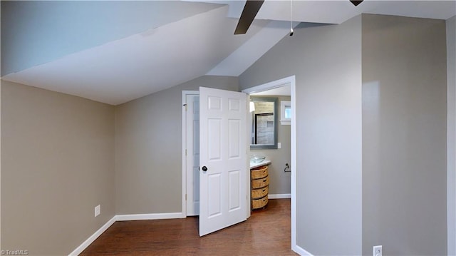 additional living space with dark hardwood / wood-style flooring and lofted ceiling