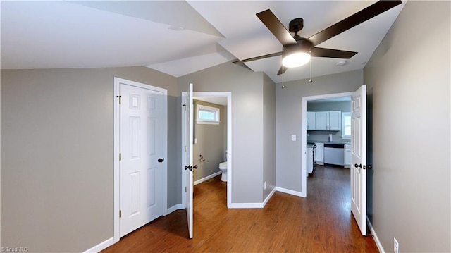 interior space featuring lofted ceiling and wood-type flooring