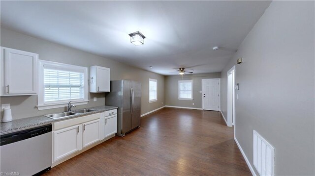 kitchen featuring ceiling fan, sink, dark hardwood / wood-style floors, white cabinets, and appliances with stainless steel finishes