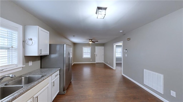 kitchen with white cabinetry, dark hardwood / wood-style flooring, ceiling fan, and sink