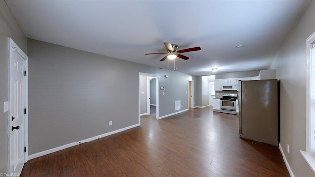 kitchen with white cabinets, ceiling fan, dark hardwood / wood-style flooring, and white appliances