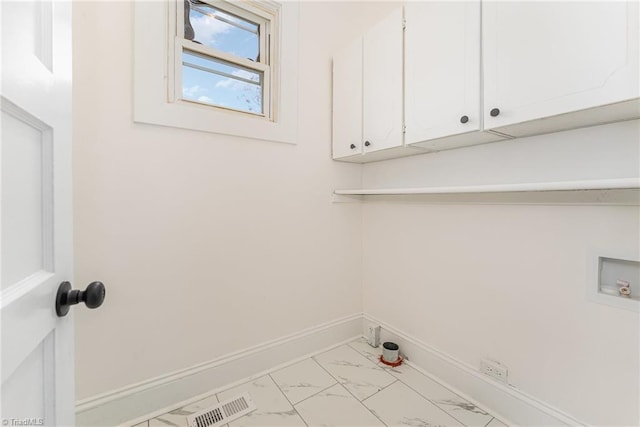 laundry area featuring marble finish floor, hookup for a washing machine, cabinet space, visible vents, and baseboards