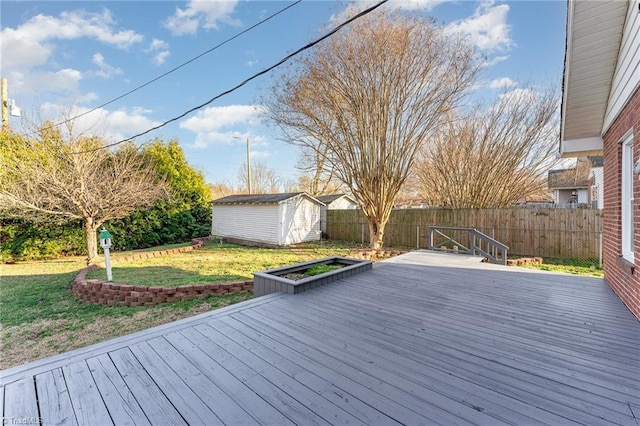 wooden deck with a yard, a fenced backyard, a storage unit, and an outdoor structure