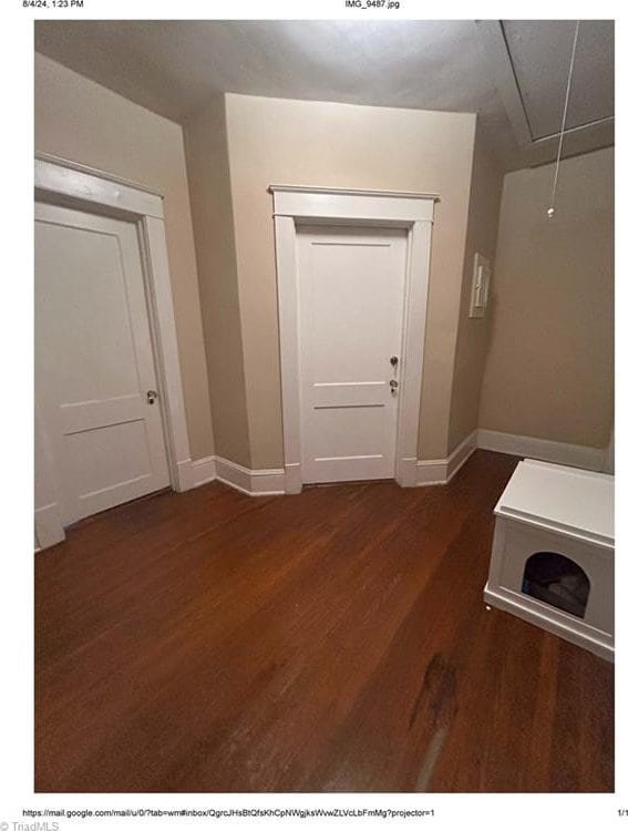 interior space with dark wood-type flooring