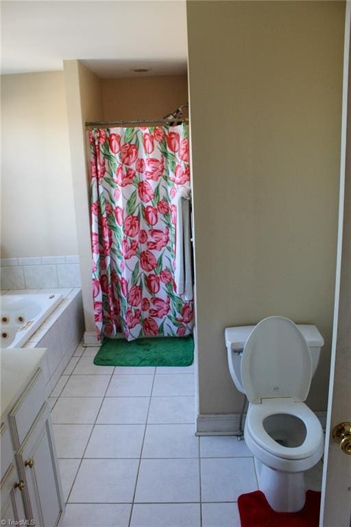 bathroom featuring a relaxing tiled tub, tile patterned floors, and toilet