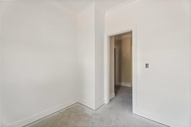 594 Cedar Dr, Winston-Salem, NC 27107 - spare room with unfinished concrete flooring and baseboards