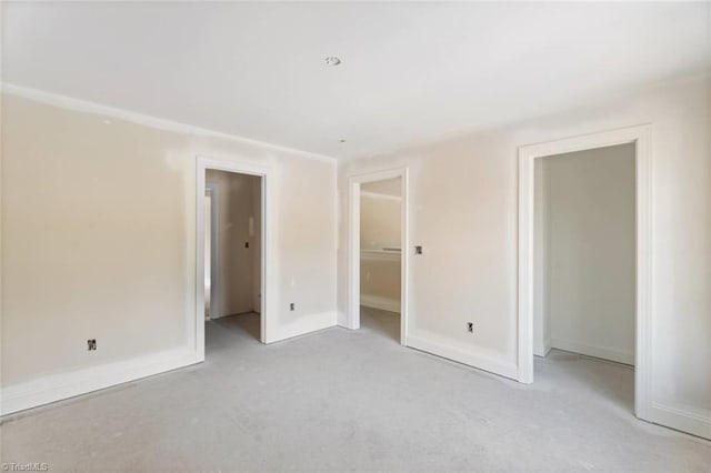 594 Cedar Dr, Winston-Salem, NC 27107 - unfurnished bedroom featuring light colored carpet and baseboards