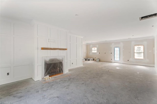594 Cedar Dr, Winston-Salem, NC 27107 - unfurnished living room with a fireplace with raised hearth and concrete floors