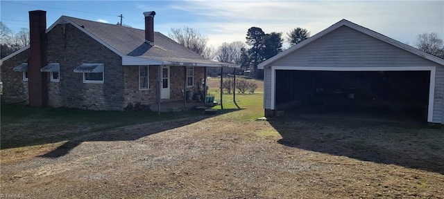 garage featuring a lawn