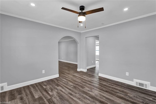 unfurnished room with crown molding, dark hardwood / wood-style flooring, and ceiling fan