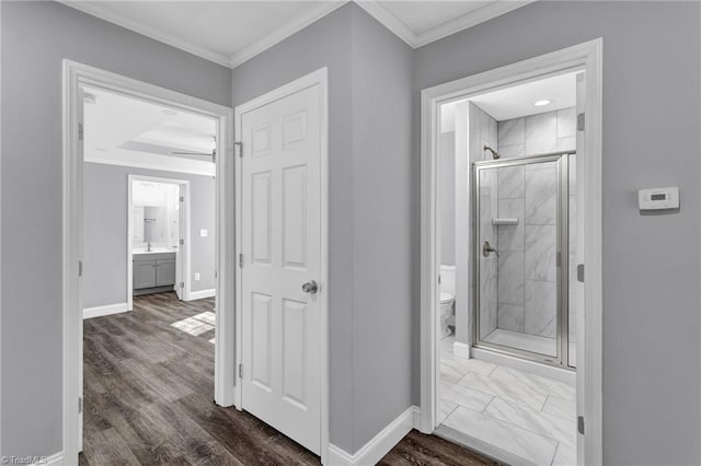 bathroom with toilet, an enclosed shower, hardwood / wood-style floors, and vanity